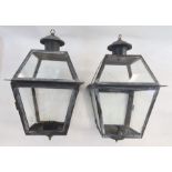 Pair of modern metal and glass candle lanterns with hooks to hang, approx. 57cm high (2)