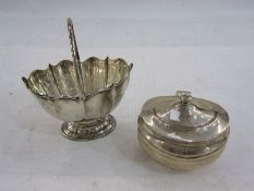 Silver tea caddy by C S Harris & Sons Ltd, London 1921 of oval form with hinged cover, 11cm long and