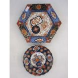 Japanese imari circular scallop dish centered by floral boughpot in typical colours, 22cm diameter