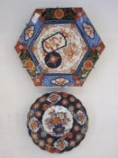 Japanese imari circular scallop dish centered by floral boughpot in typical colours, 22cm diameter