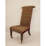 19th century prie dieu chair with needlework upholstered seat and back, turned front legs to brass