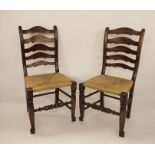 Set of eight early 20th century ladderback country chairs with rush seating, on turned front legs