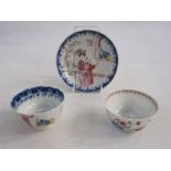 Chinese porcelain teabowl and saucer with polychrome painted figures in a garden and beside window