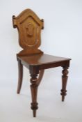 19th century mahogany shield-shaped back hall chair on turned supports, peg feet