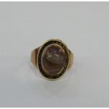Georgian gold, enamel and agate mourning ring, oval, the cabochon agate surrounded by black and gilt