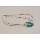 18ct white gold, opal doublet and diamond pendant, the rounded triangular-shaped opal having