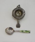 Scandinavian silver-coloured metal tea strainer with scroll decoration and a Georg Jensen sterling