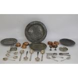 Six copper jelly moulds, three pewter plates and assorted EPNS flatware