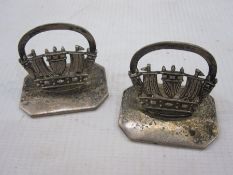 Pair of silver menu holders by John William Barrett, Chester 1922, each modelled as naval crown,