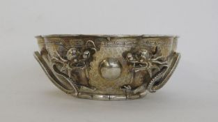 Chinese white metal bowl of lobed circular form with hammered decoration and Greek key borders, with