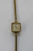 Lady’s Rotary 9ct gold wristwatch having square dial with baton numerals and the flexible mesh