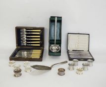 Silver-plated fish server, assorted napkin rings in stainless steel and EPNS, a Viners stainless