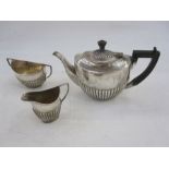 Matched silver half-gadrooned three-piece tea service, varying dates and makers, gross weight 17.5oz