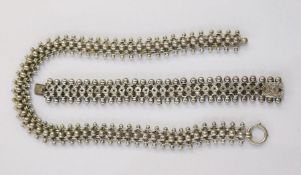 Silver-coloured metal ornate ball and pierced star-pattern bracelet and similar white metal necklace