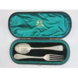 Late Victorian child's silver  bright cut fork and spoon, London 1897, in fitted case, by West &