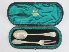 Late Victorian child's silver  bright cut fork and spoon, London 1897, in fitted case, by West &