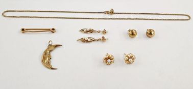 9ct gold crescent moon pendant with face, a 15ct cravat tie bar, various gold earrings and a chain