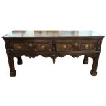18th century and later oak sideboard, the rectangular top above two geometric patterned drawers with