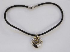 Bulgari 18ct white and yellow gold open heart pendant on leather cord strap, the pendant 23g approx.