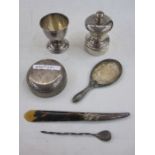 Silver pepper mill, a silver eggcup, a silver-handled tortoiseshell paper knife and sundries