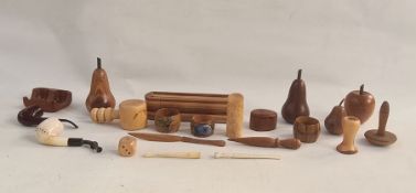 Various items of treen to include carved fruit, eg apples, pears, etc, a pipe, nutcrackers, a pencil