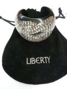 Liberty diamante and perspex cuff bracelet, black with diamante knot design