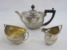 Silver three-piece teaset by Goldsmiths and Silversmiths Co. Ltd., London 1912 of semi-fluted oval