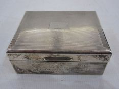 Silver engine-turned decorated and lined cigarette box with inscription 'Presented to Captain I.