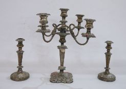 Silver-plated candelabrum of four arms and central holder and a matching pair of candlesticks (all
