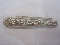 Silver folding fruit knife with ornate handle