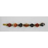 Agate and gilt metal bracelet having curved shaped lozenge, black, white and orange agate links