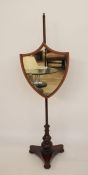 19th century pole screen, the shield-shaped mirrored screen cross-banded, on a mahogany pole, to