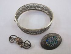 Danish silver brooch by Hermann Siersbol decorated with a leaf on a scroll, a Scandinavian silver