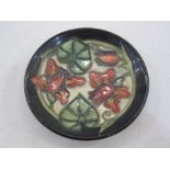 Moorcroft pottery pin tray with slip trailed decoration, 12cm diameter