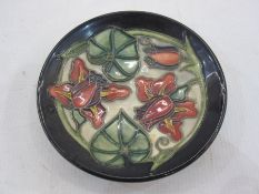 Moorcroft pottery pin tray with slip trailed decoration, 12cm diameter