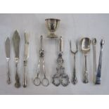 Silver eggcup, two pairs of grape scissors, sugar tongs, bread fork, etc (some items not silver)