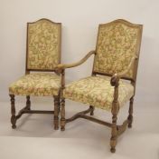 Set of six reproduction oak chairs, two open armed carvers and four dining, in revived seventeenth