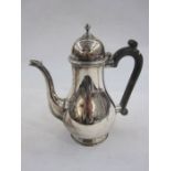 Silver coffee pot with domed cover and beak spout, ebonised handle, Birmingham 1975, gross weight