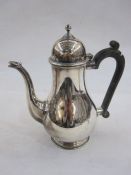 Silver coffee pot with domed cover and beak spout, ebonised handle, Birmingham 1975, gross weight