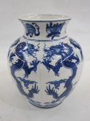 Modern Chinese vase, ovoid and slightly lobed, allover dragon decorated in underglaze blue, 23cm