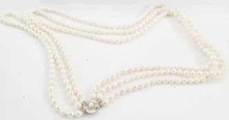 Mikimoto three-strand freshwater pearl necklace having silver flowerhead and pearl set pattern