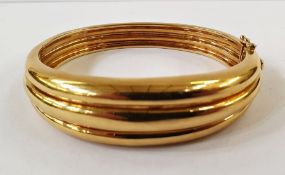 Tiffany 18K gold bangle of triple rib design, 52g Condition ReportBangle is small, approx 16.5cm