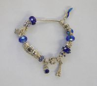 Pandora-style charm bracelet with blue glass and other charms and a Pandora box
