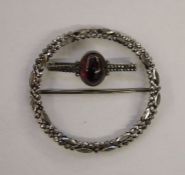 Georgian cut steel buckle of circular form, 8cm diameter and a marcasite bar brooch set with central