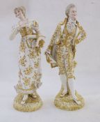 Pair 19th century Sitzendorf gilt porcelain figures of lady and gentleman, the lady carrying
