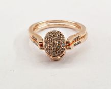 Rose gold ring of double-shank and swivel design, set with four central brown diamonds and the