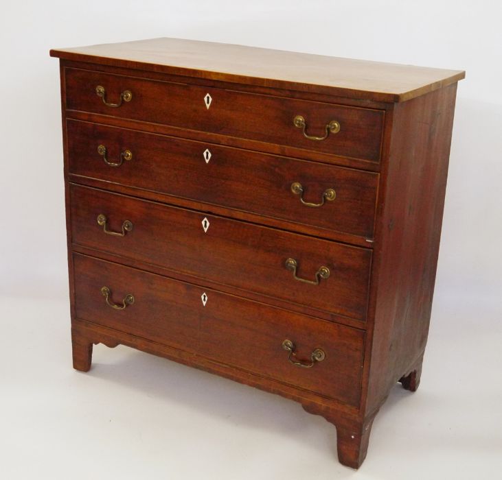 19th century mahogany cross-banded and boxwood strung chest of four long graduated drawers, brass