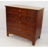 19th century mahogany cross-banded and boxwood strung chest of four long graduated drawers, brass