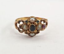 Early Victorian gold ring set with four seedpearls interspersed by garnets and rubies, with engraved