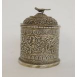 Two Burmese silver-coloured metal trinket boxes, one rectangular with hinged lid, stylised floral